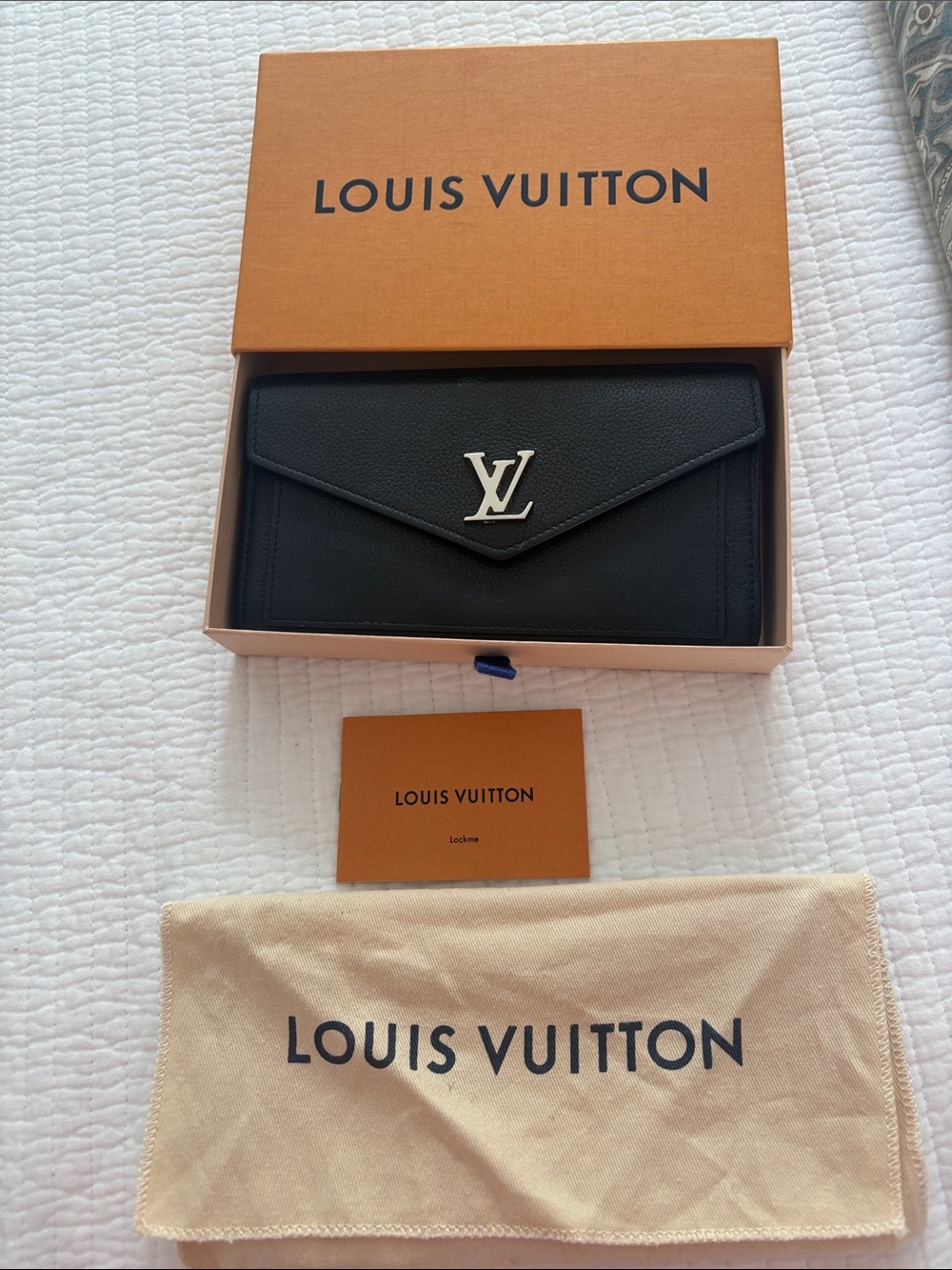 Louis Vuitton “Lockme” Black Envelope Wallet with Silver LV Emblem